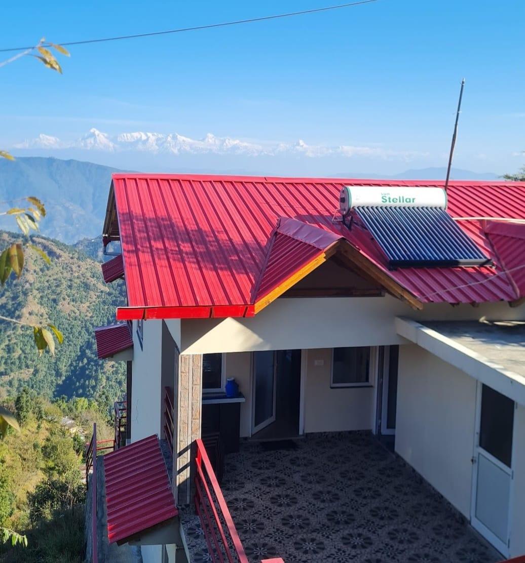 Himtattva homestay terrace with the Himalayan snow peaks in the distance